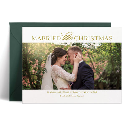 Custom Christmas card featuring a wedding photo and text 'Married Little Christmas' in golden ink