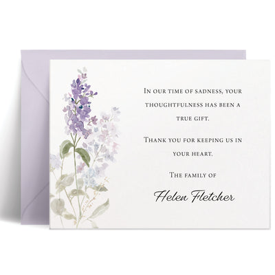 Personalized bereavement card with delicate purple lilacs and green leaves in watercolor style, heartfelt condolence message in grey ink, elegant sympathy stationery