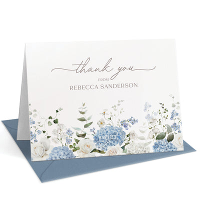 This personalized thank you card set features classic, elegant blue hydrangeas paired with white roses