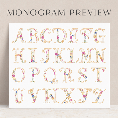 This folded floral notecard set features a beautiful, colorful monogram letter at the center of the card