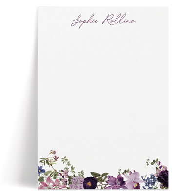 This personalized notepad is beautifully adorned in a garden of rich, purple flowers