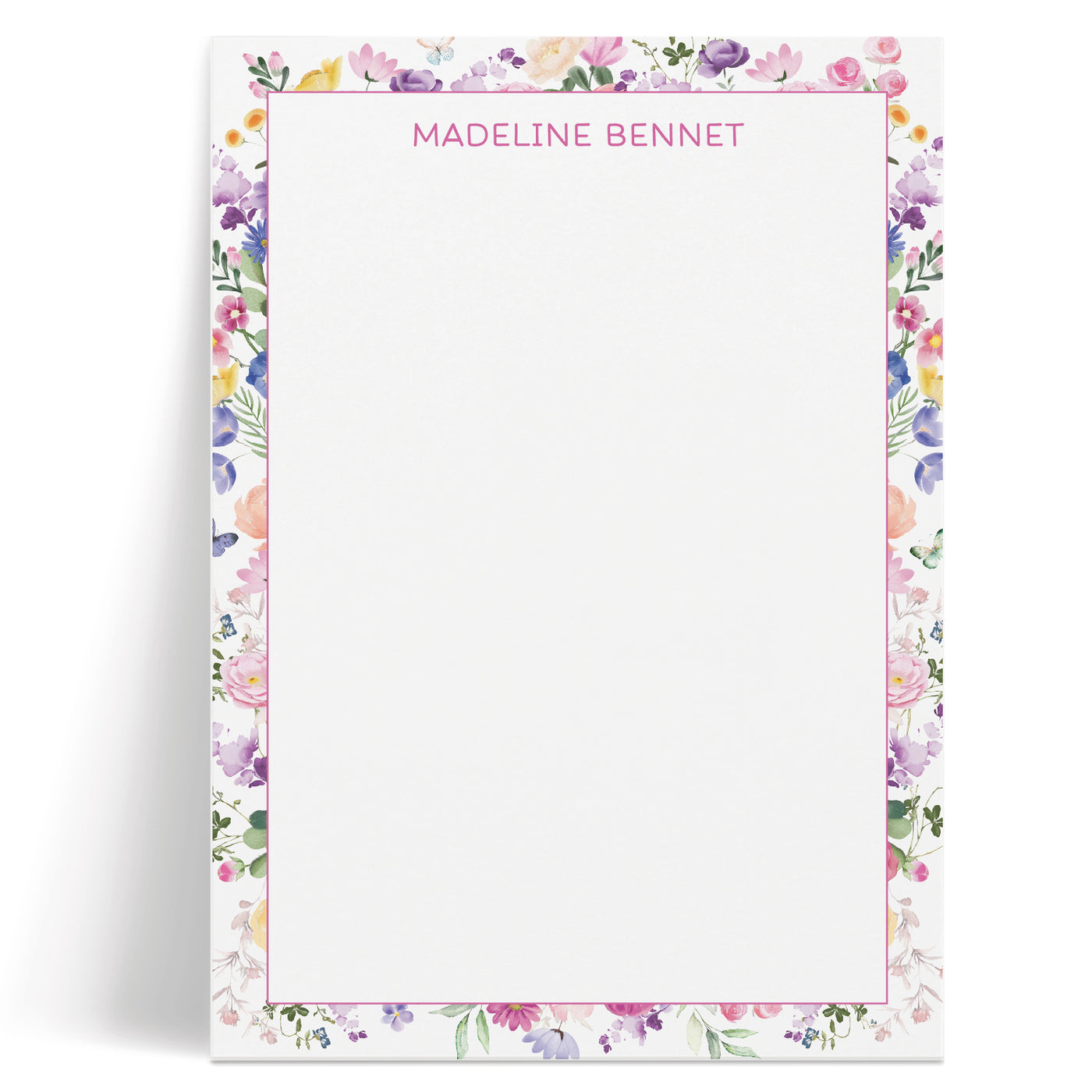 A delightful, colorful floral border adorns this custom notepad along with your name or other personalization