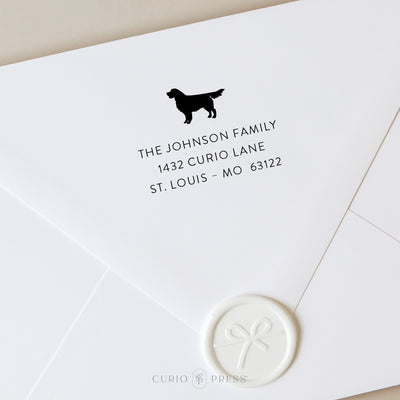 Personalized address stamp with Golden Retriever silhouette and clean modern text, stamped in black ink on envelope