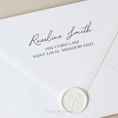 Elegant address stamp with flowing script name and printed address text, stamped on envelope with floral and vintage styling